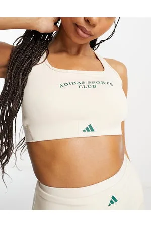 https://images.fashiola.in/product-list/300x450/asos/100706361/adidas-training-sports-club-graphic-mid-support-sports-bra-in.webp