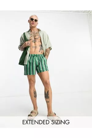 ASOS Swim shorts in short length in green stripe