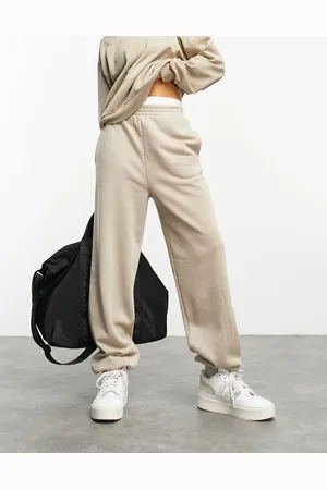 ASOS Jogger in washed neutral with wca logo