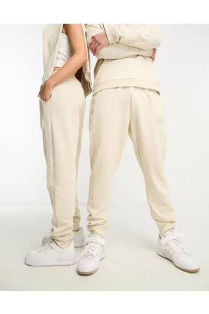 https://images.fashiola.in/product-list/300x450/asos/102756457/unisex-owen-joggers-in-oatmeal.webp