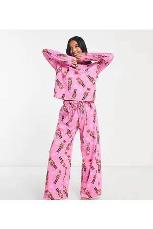 ASOS ASOS DESIGN Petite Christmas nutcracker long sleeve top & trouser pyjama set in