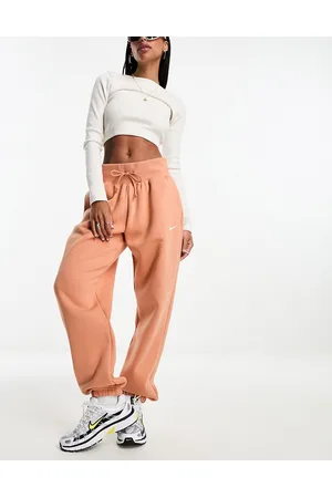 https://images.fashiola.in/product-list/300x450/asos/103221689/mini-swoosh-oversized-high-rise-joggers-in-amber.webp
