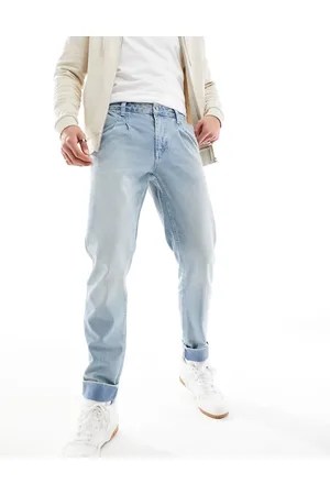 ASOS Tapered fit turn up jeans with pleats in mid - MBLUE