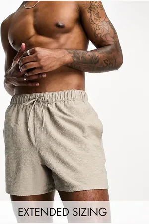 ASOS Seersucker swim shorts in short length in beige