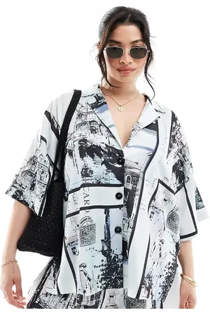 ASOS ASOS DESIGN Curve satin revere co-ord shirt in newspaper print