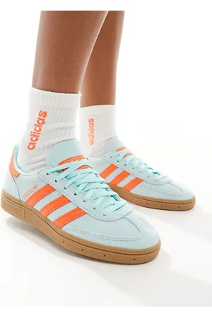 adidas Handball Spezial trainers in aqua and orange with gum sole