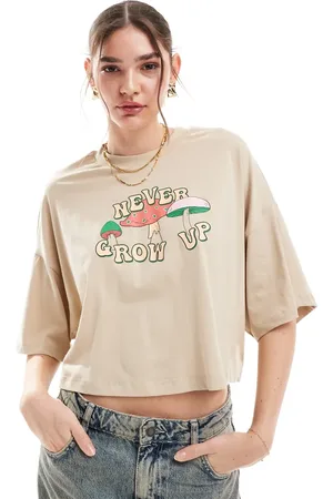 ONLY Never grow up graphic cropped t-shirt in beige