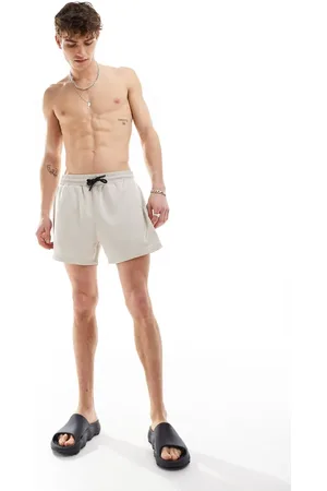COLLUSION Shorter length swim short in stone