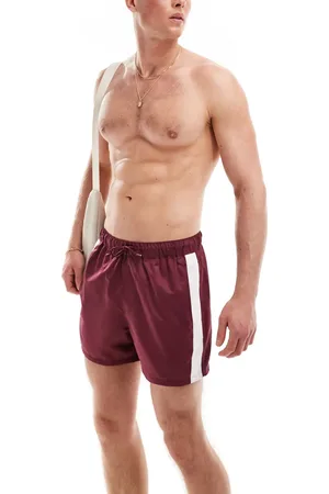 ASOS Short length swim shorts with contrast side panels in burgundy
