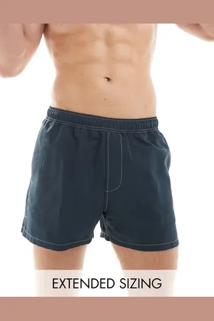 ASOS Swim shorts in short length with contrast stitch detail in