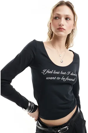 Monki Long sleeve scoop neck top in with front print