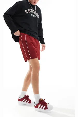 ASOS Slim nylon shorts with piping detail in burgundy
