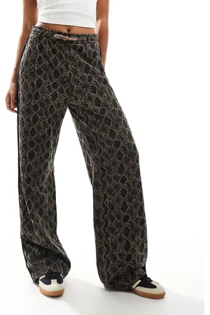 Monki Drawstring wide leg trousers in snake print with black side stripe detail