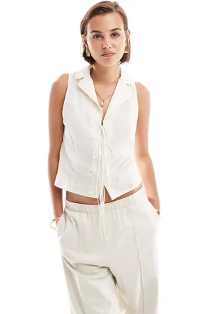 MANGO Tie front sleeveless blouse in
