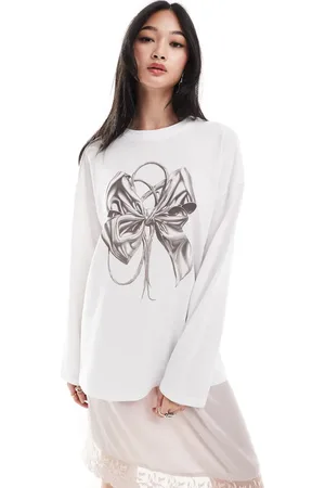 Monki Long sleeve relaxed fit top with bow print in