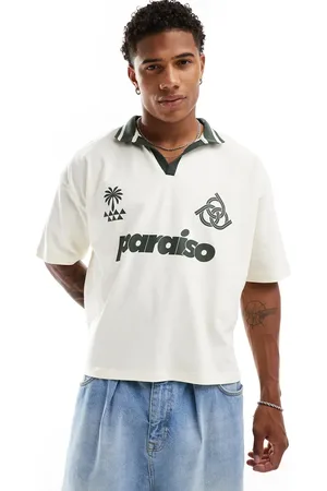 ASOS Oversized polo shirt in off with paraiso front print