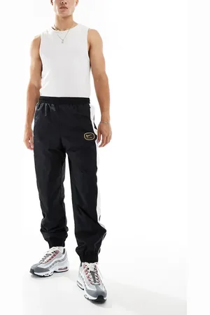 Nike Swoosh Air woven joggers in black and