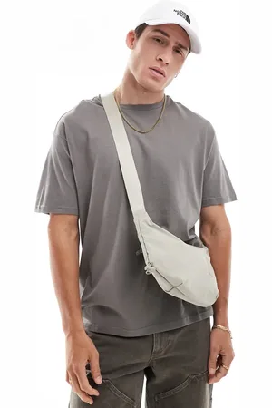 The North Face Never Stop sling cross body bag in clay gray