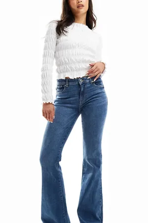 Bershka Petite high waist flared jeans in mid