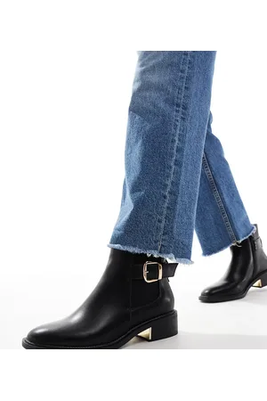 SEQWL Ankle boots with buckle details in