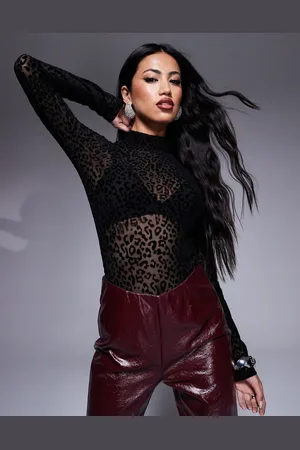 In The Style Exclusive devore long sleeve bodysuit in animal