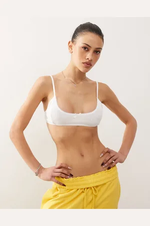 Monki Soft scoop neck pointelle bralette with small bow in