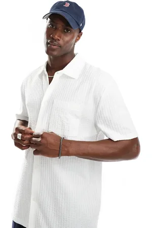 ASOS Relaxed polo shirt with front pocket in