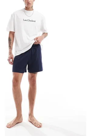 ASOS Pyjama set with late checkout slogan in and white