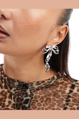 ASOS Oversized stud earrings with bow detail in tone