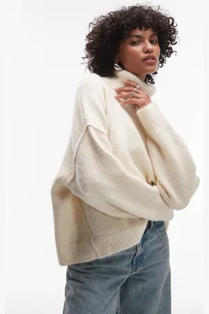 Topshop Knitted exposed seam roll neck relaxed jumper in ivory