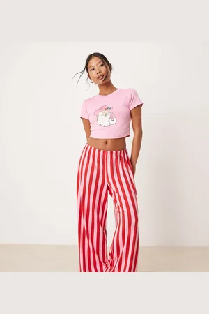 Urban Threads Petite Christmas cowboy santa polyshort sleeve t shirt and trouser pyjama set in pink and red stripe print