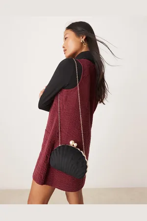 True Decadence Velvet shell clutch bag with pearl clasp in