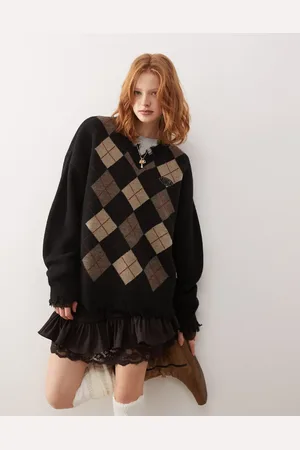 Minga London argyle v-neck jumper with distressed edges in black and beige