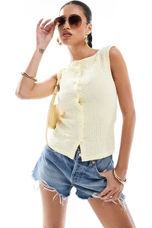 ASOS Textured sleeveless waistcoat top in lemon