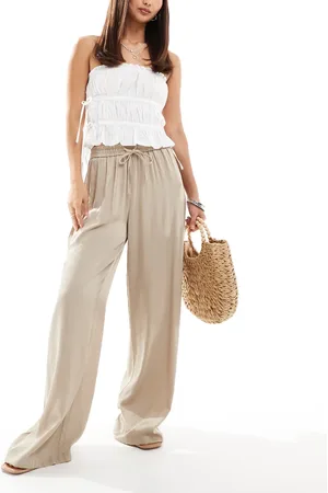 VILA Weighted plisse satin feel wide leg trousers in beige
