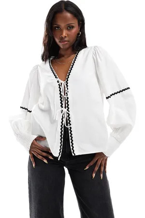 Pieces® Tie front balloon sleeve top with contast rikrak trim in