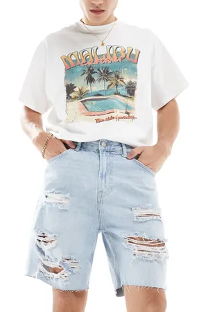 Bershka Ripped denim short in light