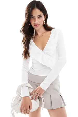 ASOS Frill wrap top with ruffle cuff in ivory