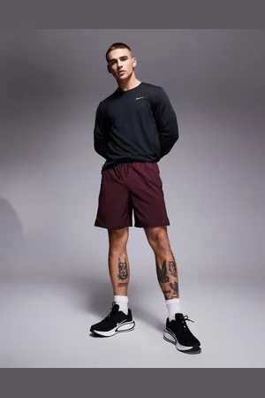 Nike Dri-Fit Unlimited woven 7 inch shorts in burgundy
