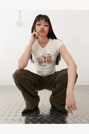 Noisy May Baby tee with cowgirl boot flocking in