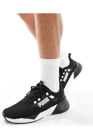 PUMA Retaliate 3 trainers in & white