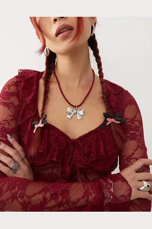 Reclaimed Necklace with bow pendant on red cord