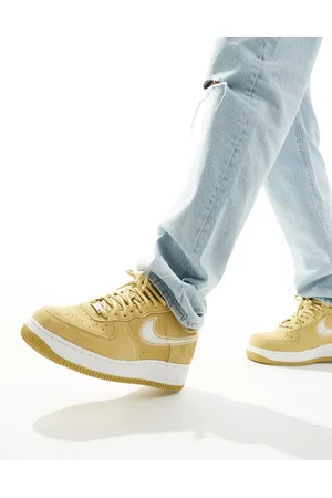 Nike Air Force 1 trainers in beige