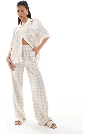 The Couture Club Co-ord emblem print wide leg trousers in beige