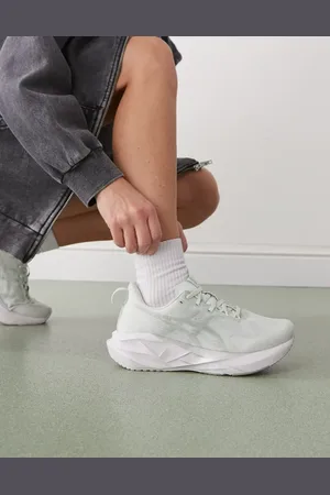 Asics Novablast 5 trainers in aqua and