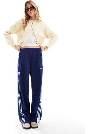 adidas Firebird track pants in with badge