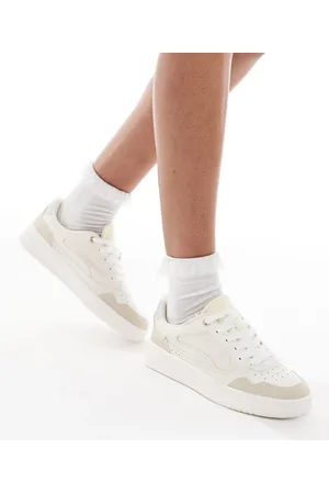 Stradivarius Flatform trainer in beige and