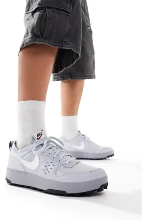 Nike C1TY trainers in and white