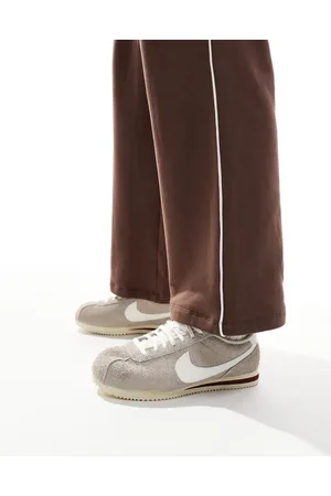 Nike Cortez trainers in beige and