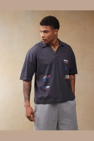ASOS Boxy oversized polo with dropped shoulder and multiplacement sport print in navy
